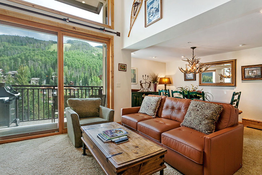 Livingroom and glass sliding doors to balcony unit 705.