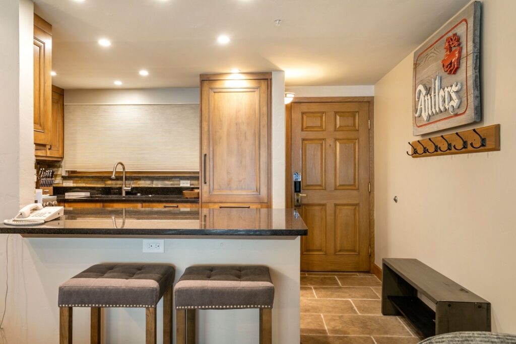 View of the kitchen and entryway for condo 105 Antlers at Vail