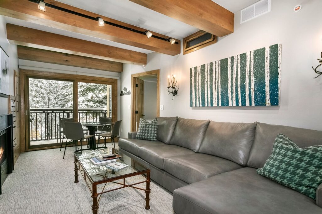 View of the living room and dining area of condo 105 Antlers at Vail