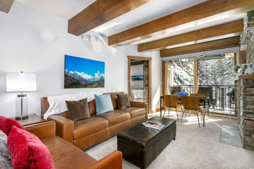 View of living room, dining area balcony condo 106 Antlers at Vail
