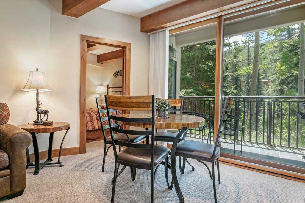 View of dining area and balcony condo 108 Antlers at vail