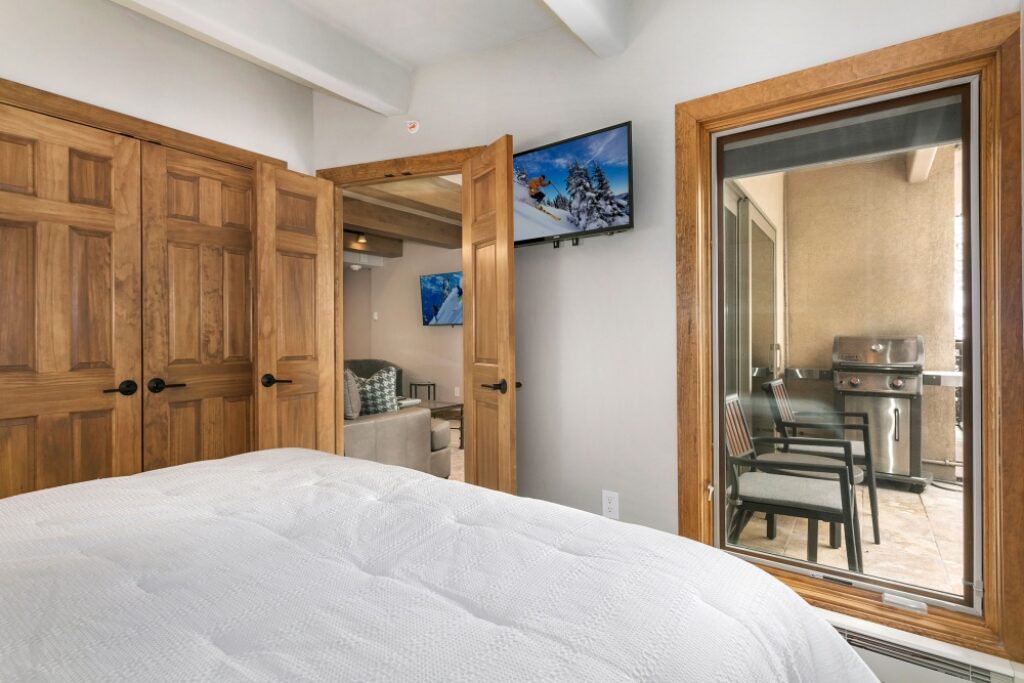 View of bedroom and balcony condo 105 Antlers at Vail