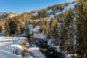 Winter view of the mountain and creek from the balcony of Antlers at Vail condo 403