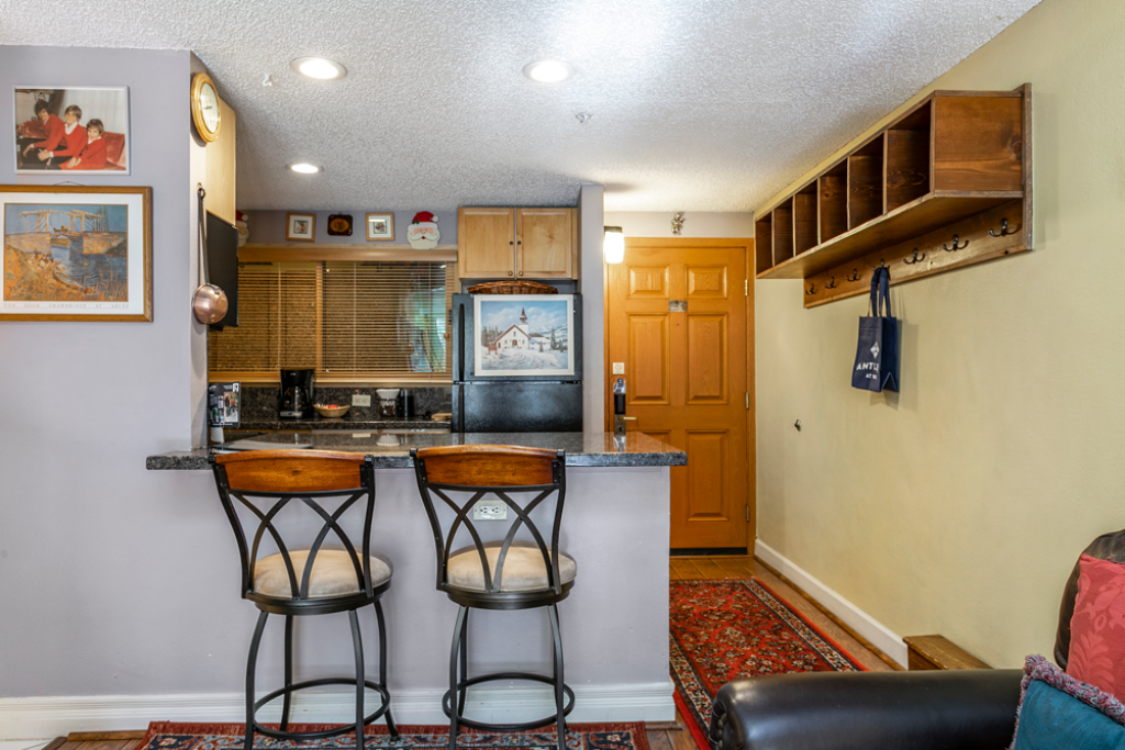 view of breakfast bar, kitchen and entry way antlers at vail unit 307