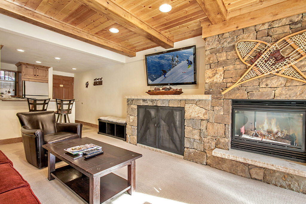 living room, entryway, fireplace in condo 205 Antlers at Vail