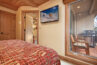 View of bedroom and window looking at balcony for unit 207 Antlers at Vail