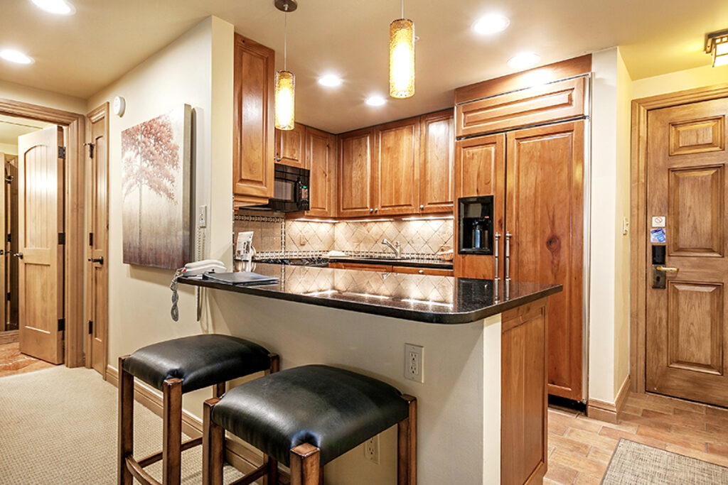 View of kitchen and breakfast bar for condo 207 Antlers at Vail