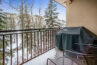 snow covered view from the balcony with grill of antler at vail condo 208