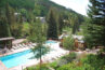 View of Antlers pool and Vail Mountain from balcony of condo 210 Antlers at Vail