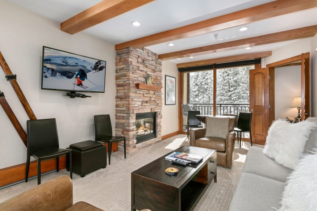 View of living room, dining area, fireplace condo 303 Antlers at Vail