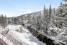 View of snowy gore creek and Vail Mountain from balcony of condo 303 Antlers at Vail