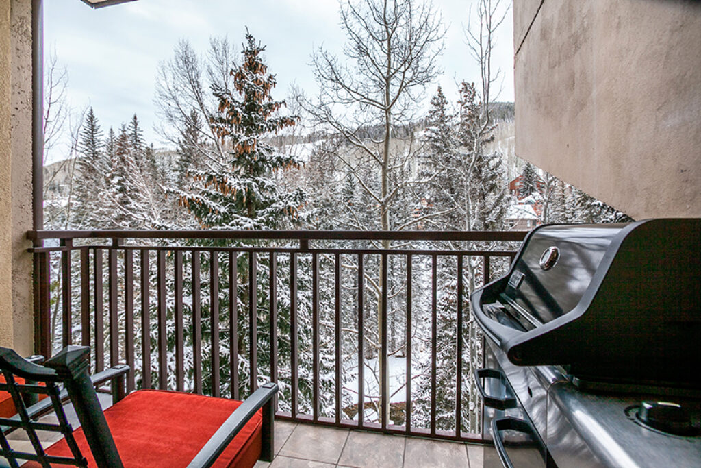 Balcony of Antlers at Vail condo 308 with gas grill and views of snowcovered trees