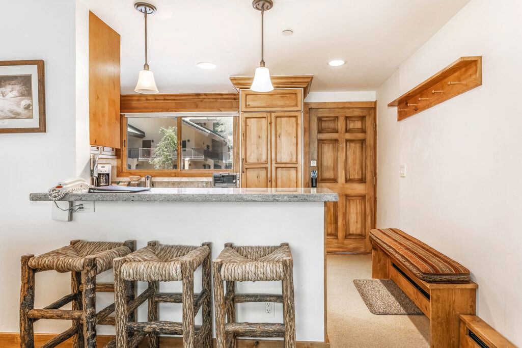 Bar, kitchen and entry of Antlers at Vail condominium 407