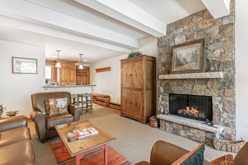 Living room of Antlers at Vail condo 407 with warm gas fireplace