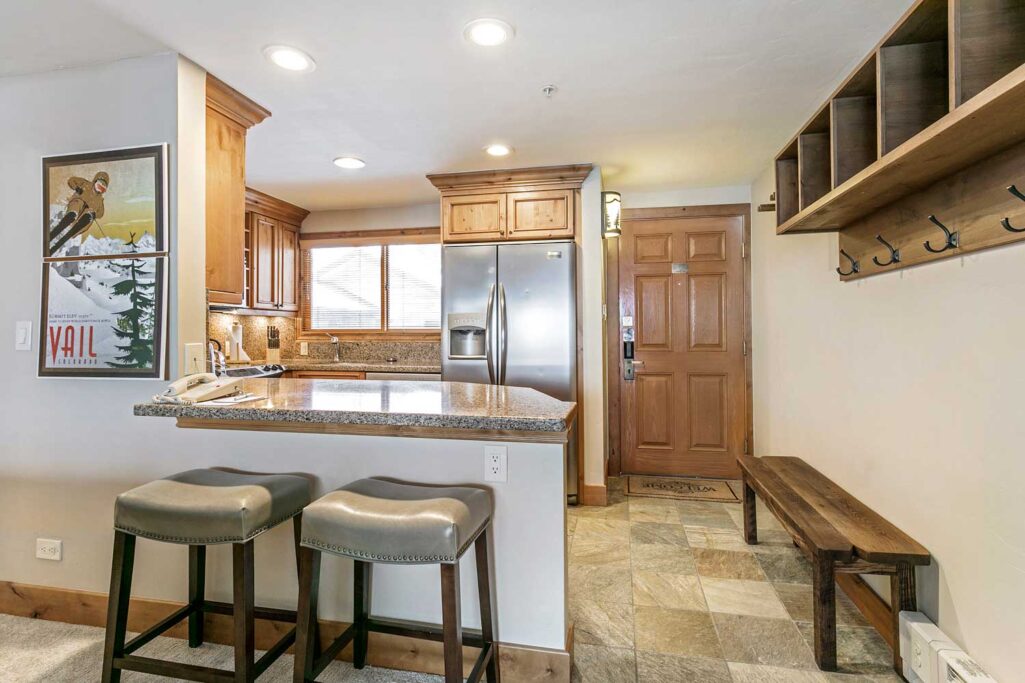 Fully equipped kitchen and entrance of Antlers at Vail unit 507