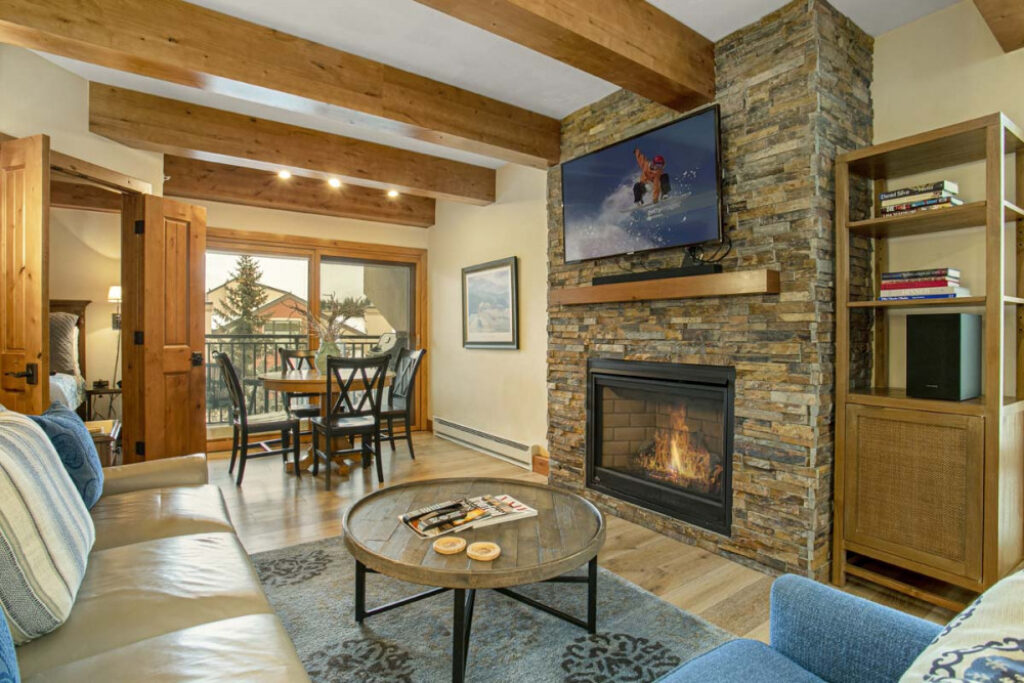 View of living room, fireplace, dining area condo 602 Antlers at vail