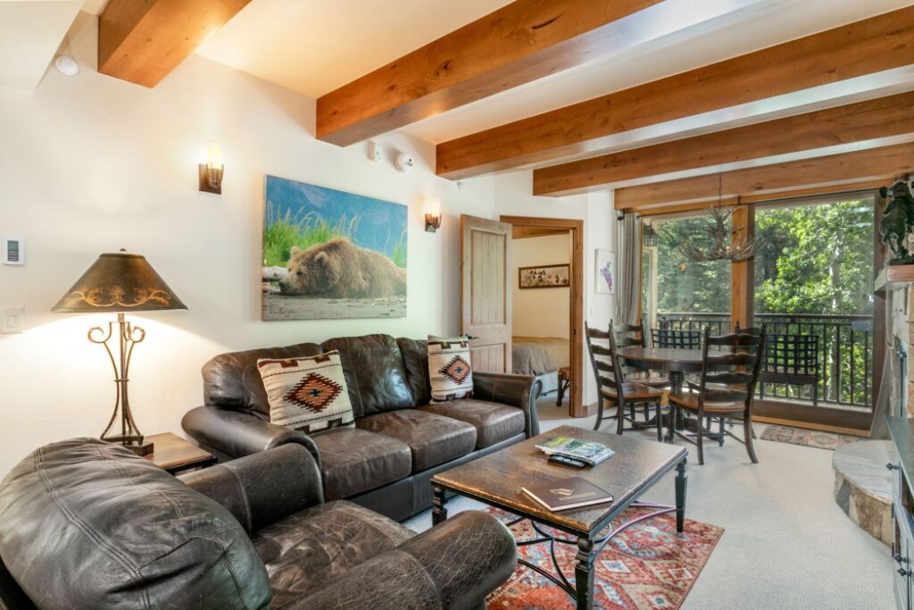 View of living room and dining area of condo 204 Antlers at Vail