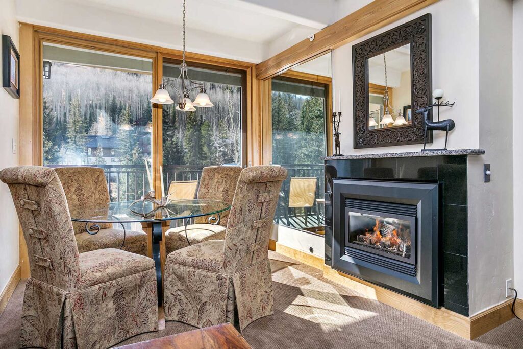 View of dining area and fireplace condo 210 Antlers at Vail