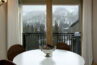 Dining area with large sliding glass doors to the balcony with mountain views from Antlers at Vail unit 508