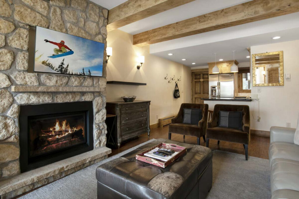 Living room of Antlers at Vail condo #508 with cozy gas fire going in the fireplace