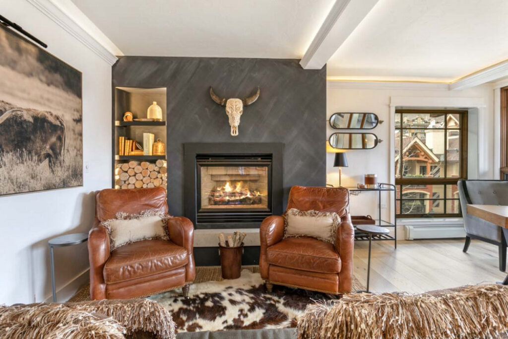 sitting area by warm fire place in living room of antlers unit 520
