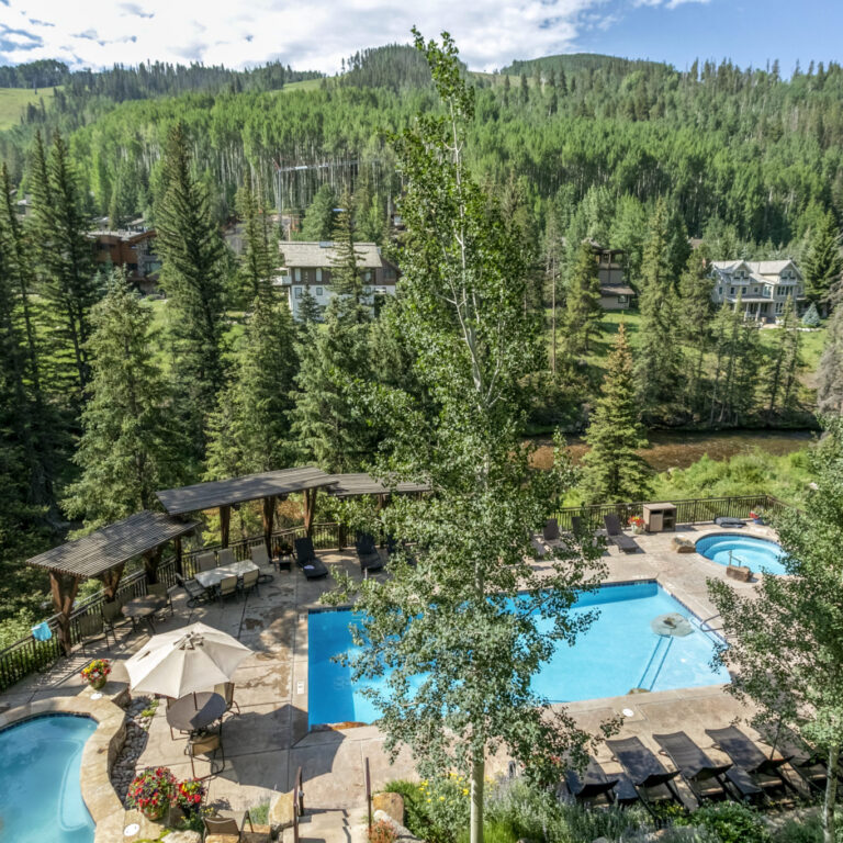 View of Antlers pool and Vail Mountain from balcony of condo 204 Antlers at Vail