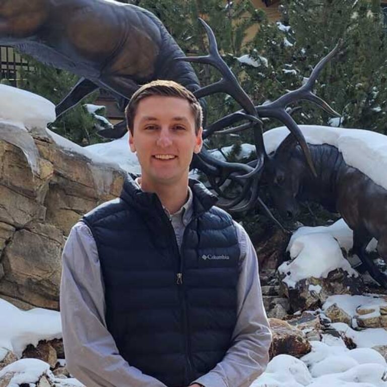 Antlers assistant general manager, Jeff Severini, in front of the elk statue