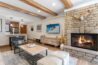 Living area of Antlers at Vail condo 311 with cozy gas fireplace
