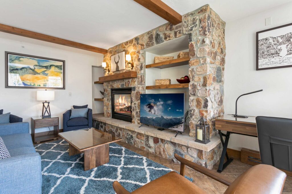 Living area of Antlers at Vail condo 414 with cozy gas fireplace