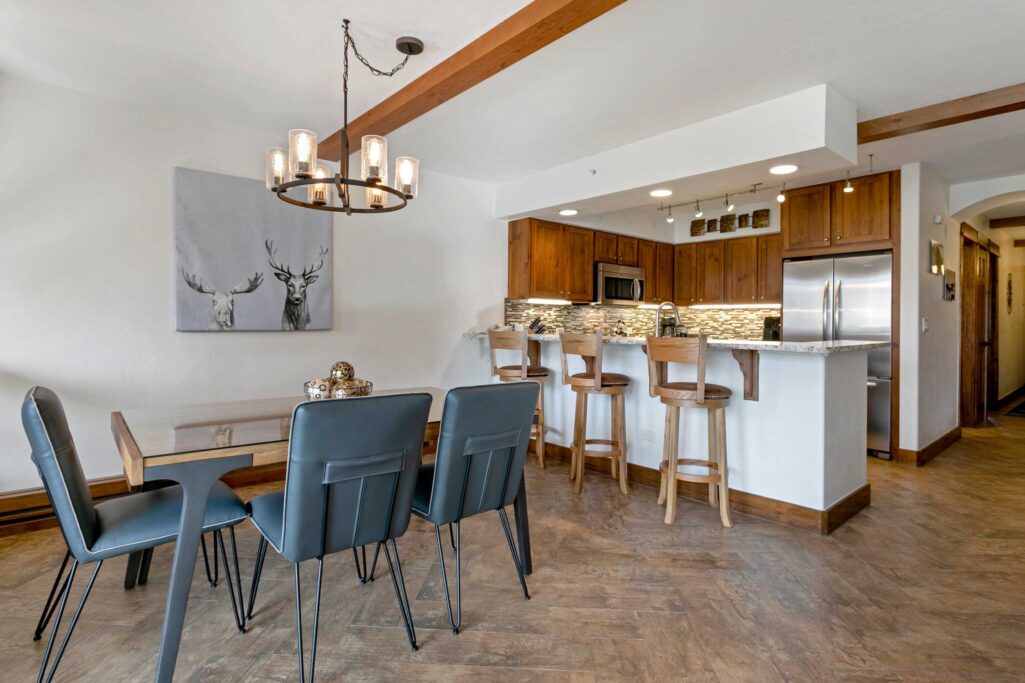 Modern dining area and full kitchen of Antlers at Vail condo 414