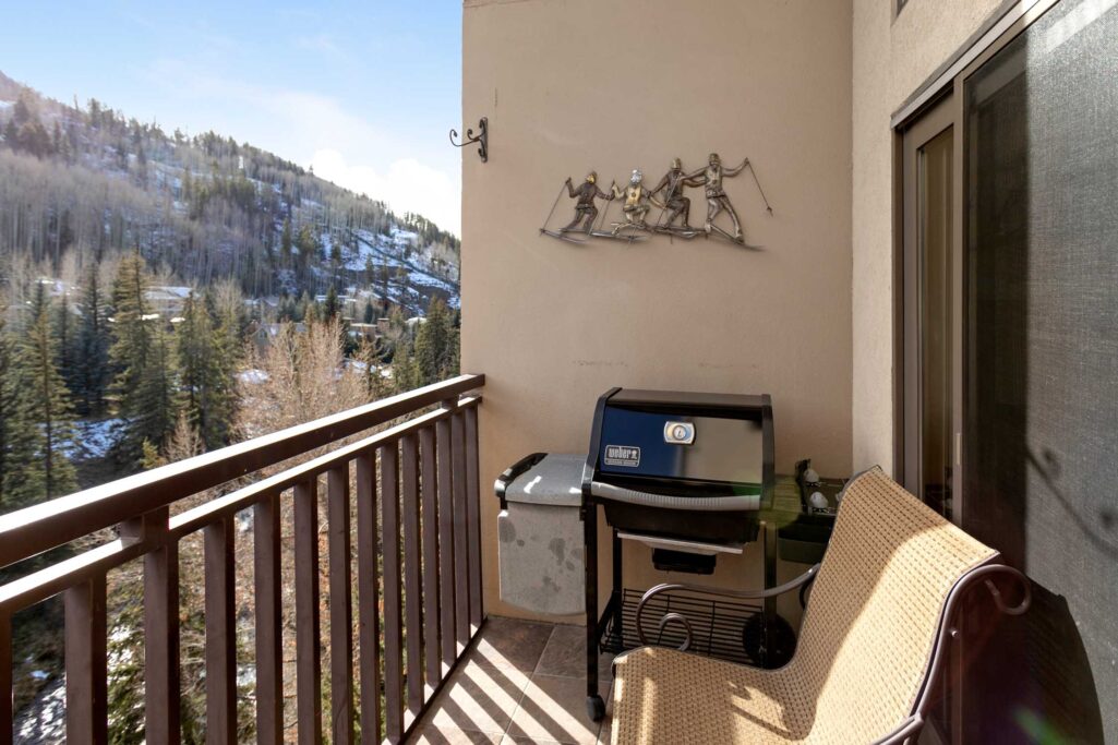 Deck of Antlers 3 bedroom condo 704 with gas grill and mountain views