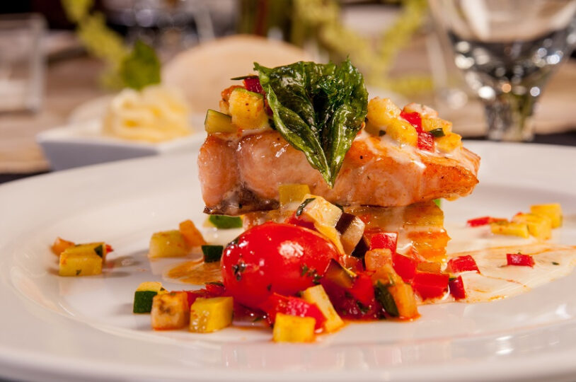 plated fish with colorful garnish