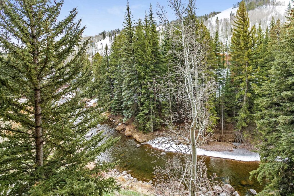 Creek and mountain view from Antlers at Vail condo 304