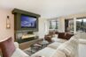 Bright living room of Antlers at Vail condo 321, with cozy gas fireplace