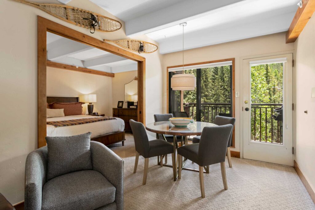 dining area of Antlers at Vail unit 304 with views of the creek below