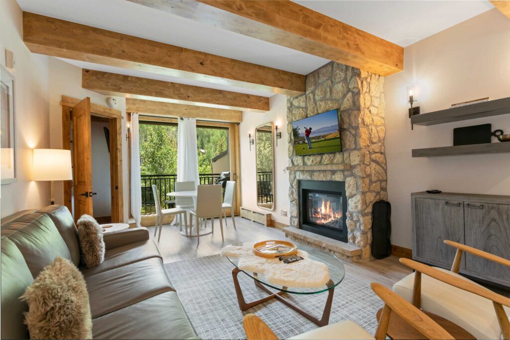 living and dining room of Antlers at Vail unit 508 with views to Vail Mountain