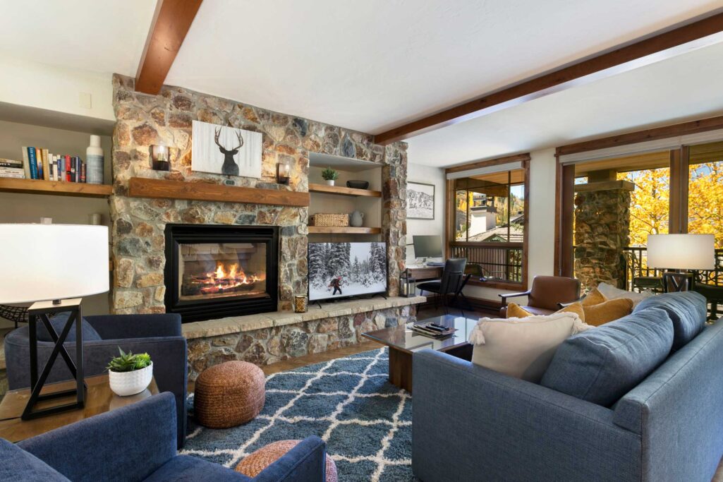 Living room with cozy fireplace of Antlers at Vail condo 414