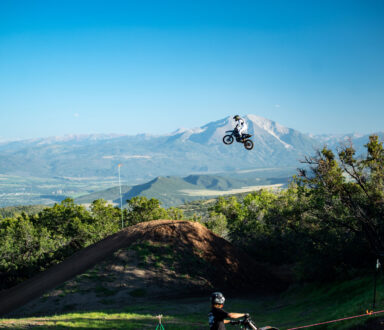 chief engineer parker herring flying on his dirt bike