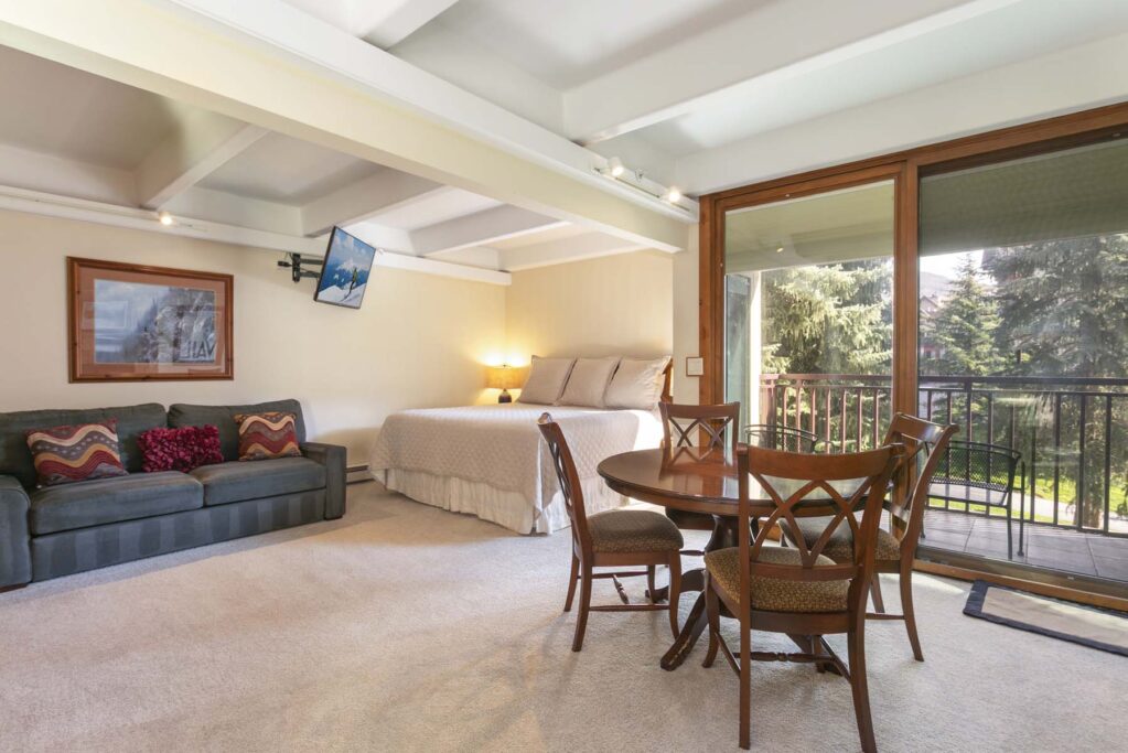 Bedroom and dining area of Antlers at Vail studio 302