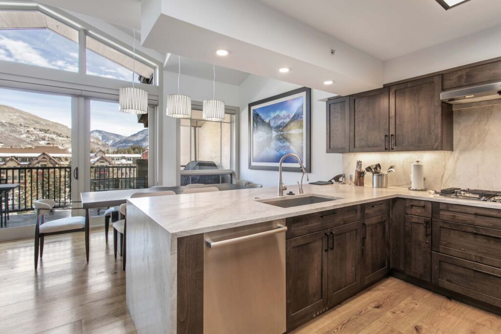 open kitchen and dining area of Antlers at Vail four-bedroom diamond residence 621