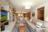 Antlers at Vail condo 316 living room with stone fireplace and mountain lodge décor