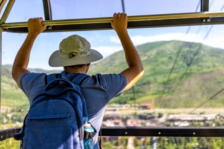 man in a gondola taking in the view